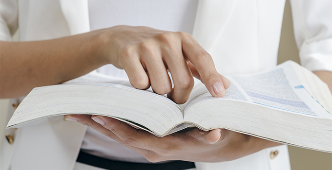 Open reference book representing book indexing